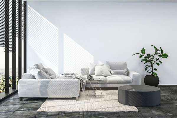 A White Sofa On A Dark Wooden Floor