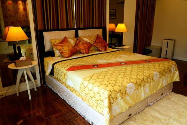 Calm Yellow Bedroom Suite Sitting Area