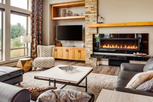 Establishing A Cohesive Design By Integrating The Fireplace As The Main Focus