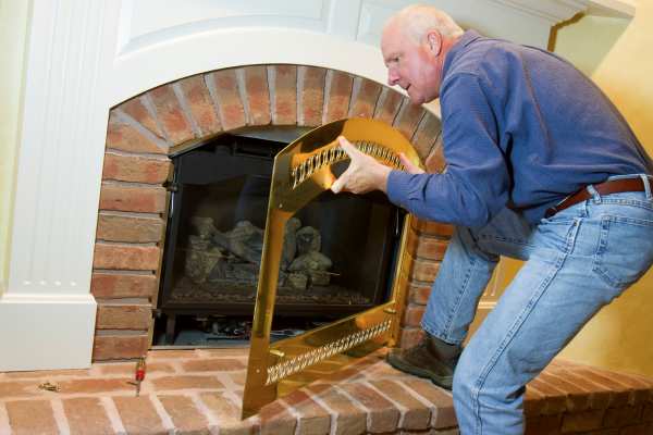 Remove your fireplace’s outer cover